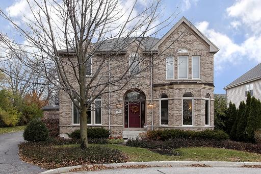 800 De Roo Loop Highwood, IL 60040 - Photo 1 of 16 a front view of a house with garden