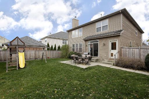 800 De Roo Loop Highwood, IL 60040 - Photo 16 of 16 a view of a house with backyard and a tree