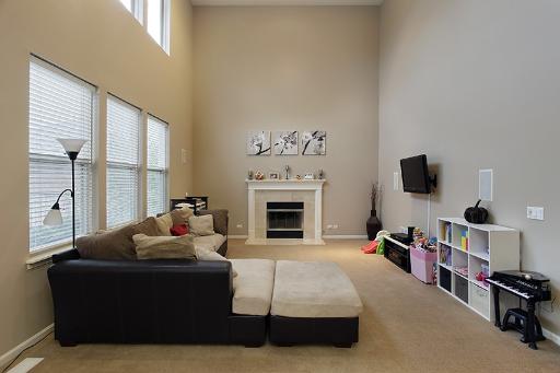 800 De Roo Loop Highwood, IL 60040 - Photo 7 of 16 a living room with furniture and a fireplace