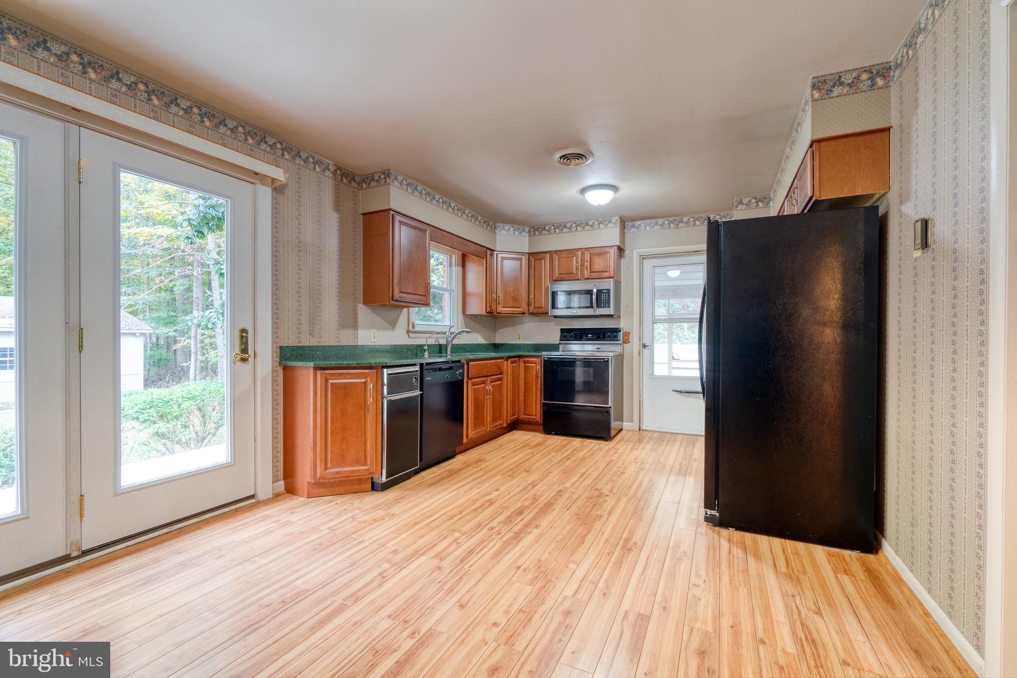 8579 Camp Road Chestertown, MD 21620 - Photo 15 of 36 Kitchen with access to patio and screened in porch