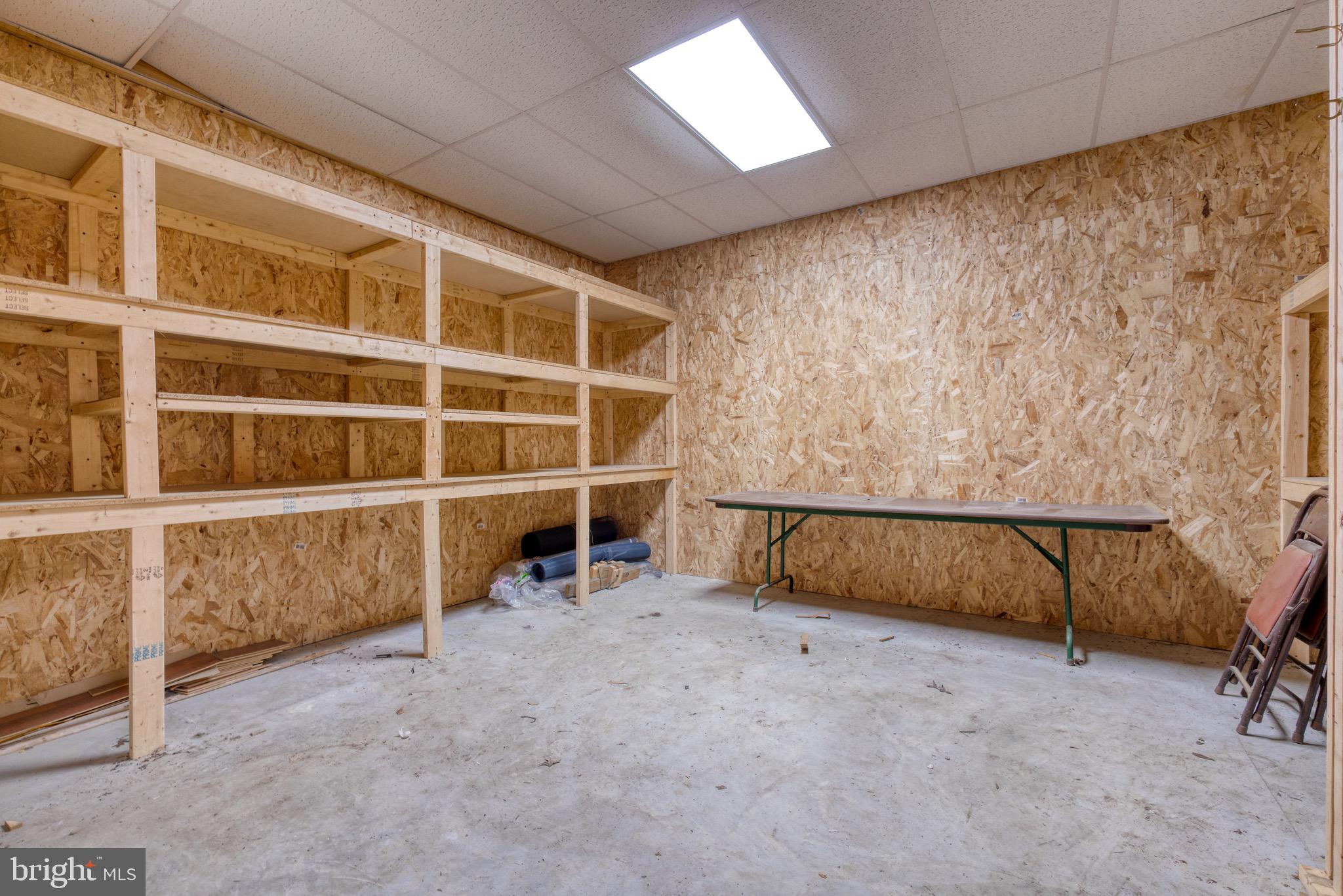 8579 Camp Road Chestertown, MD 21620 - Photo 8 of 36 Workshop area in garage