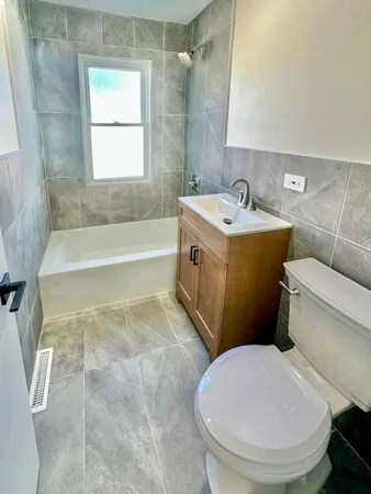 a bathroom with a sink a toilet and a bathtub
