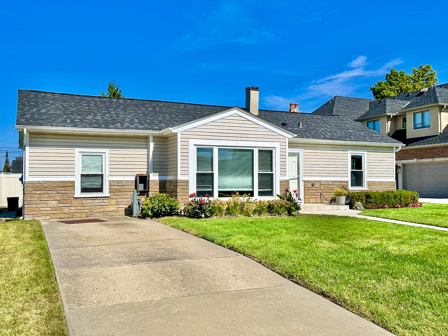 8150 West Winnemac Avenue Norridge, IL 60706 - Photo 2 of 14 a front view of a house with a yard and porch