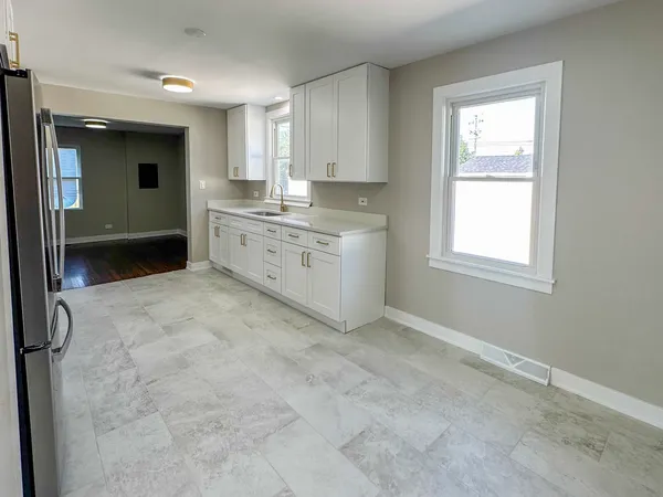 a bathroom with a sink vanity and mirror