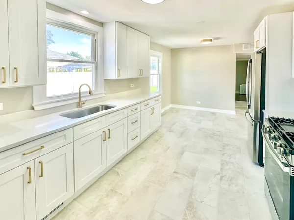 a large bathroom with a sink and a large mirror