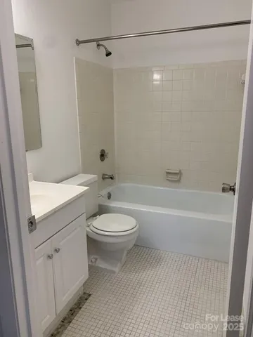 a bathroom with a toilet a sink and a bathtub