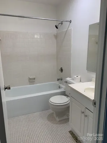a bathroom with a sink a toilet and a bathtub