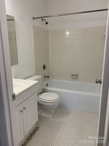 a bathroom with a toilet a sink and a bathtub