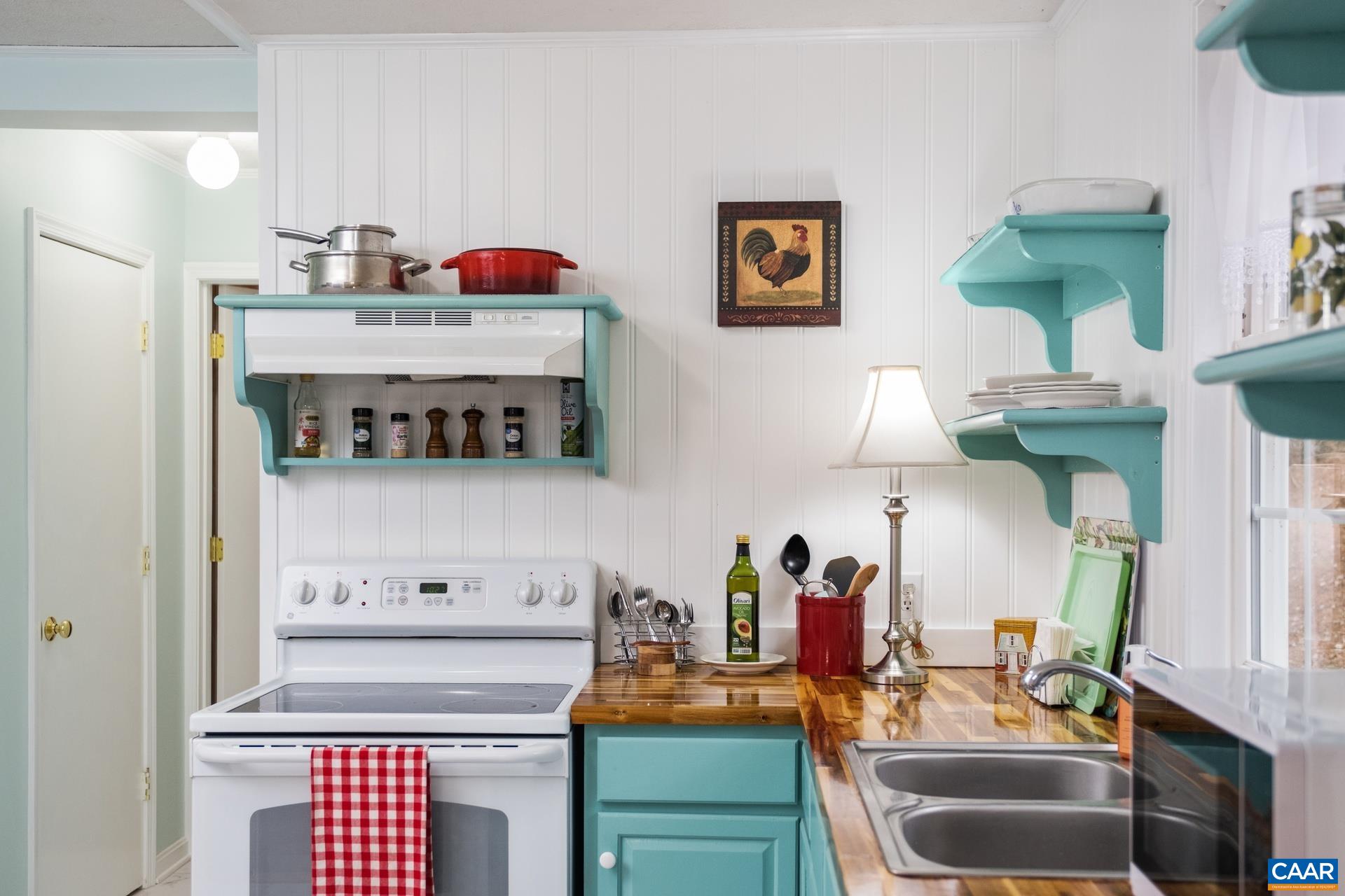 115 Circle Road Stanardsville, VA 22973 - Photo 13 of 28 a cabinet with a sink and a stove