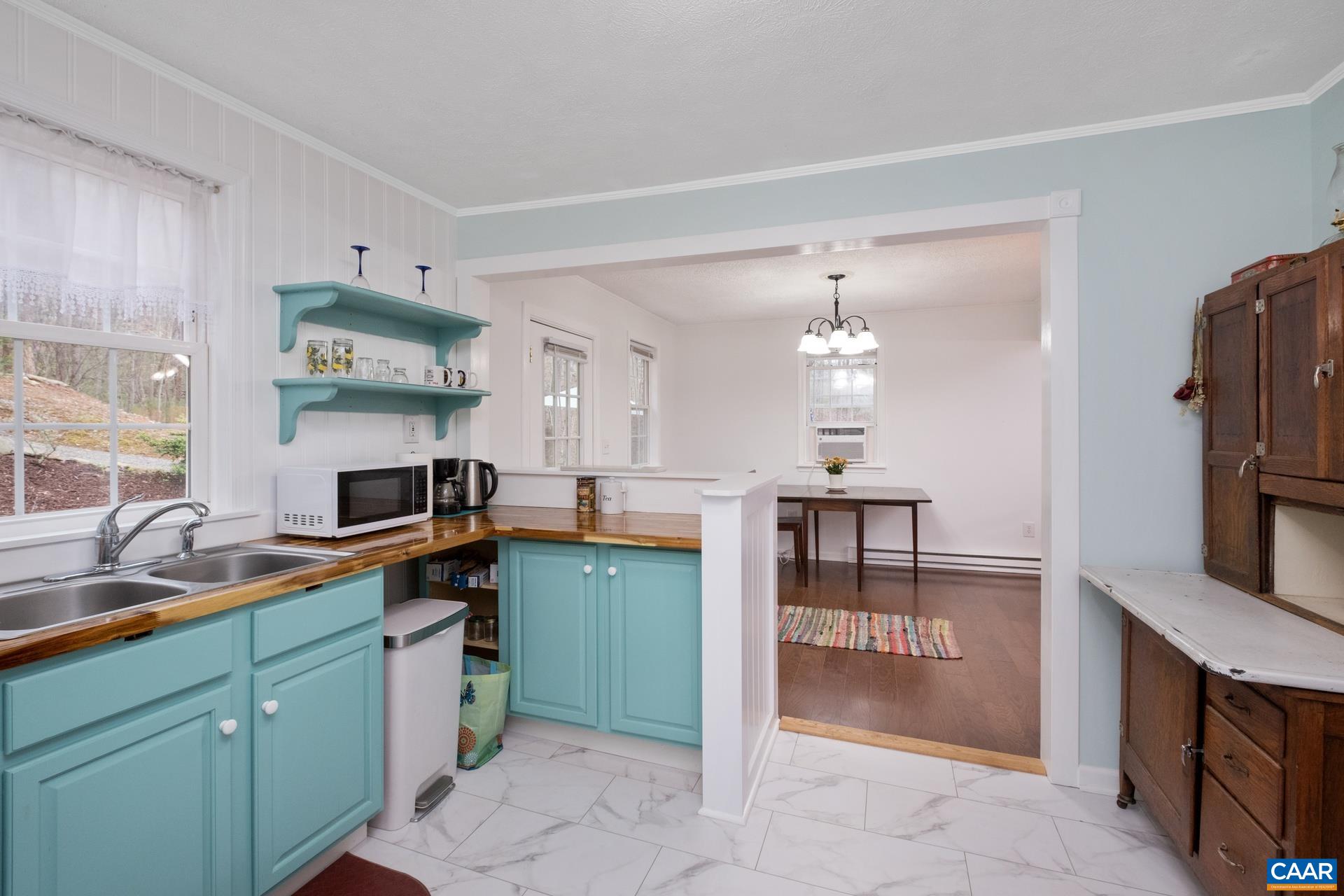 115 Circle Road Stanardsville, VA 22973 - Photo 16 of 28 a kitchen with stainless steel appliances granite countertop a refrigerator and a sink