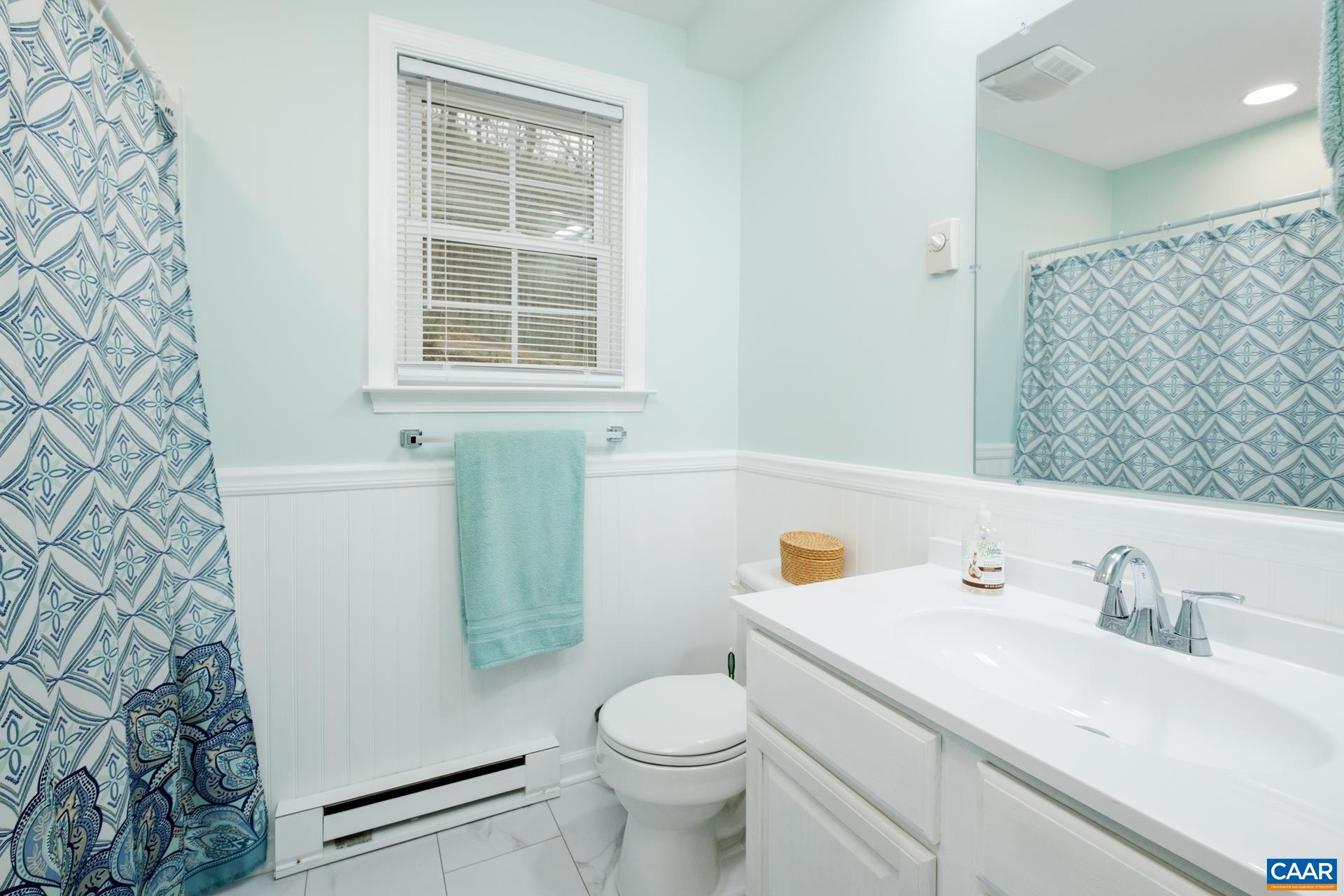 115 Circle Road Stanardsville, VA 22973 - Photo 19 of 28 a bathroom with a sink a toilet and a mirror
