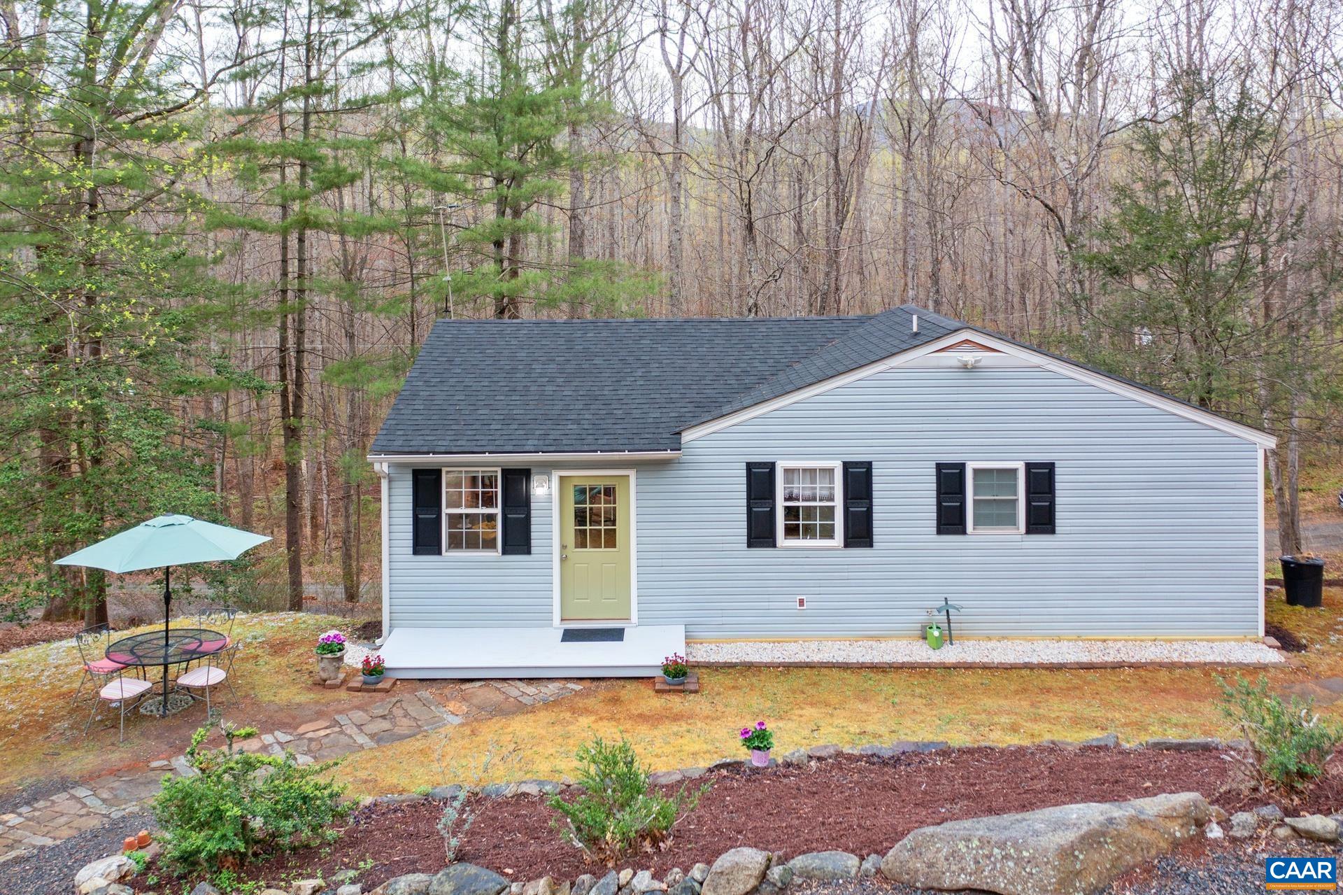 115 Circle Road Stanardsville, VA 22973 - Photo 2 of 28 a house that has a lot of plants in it