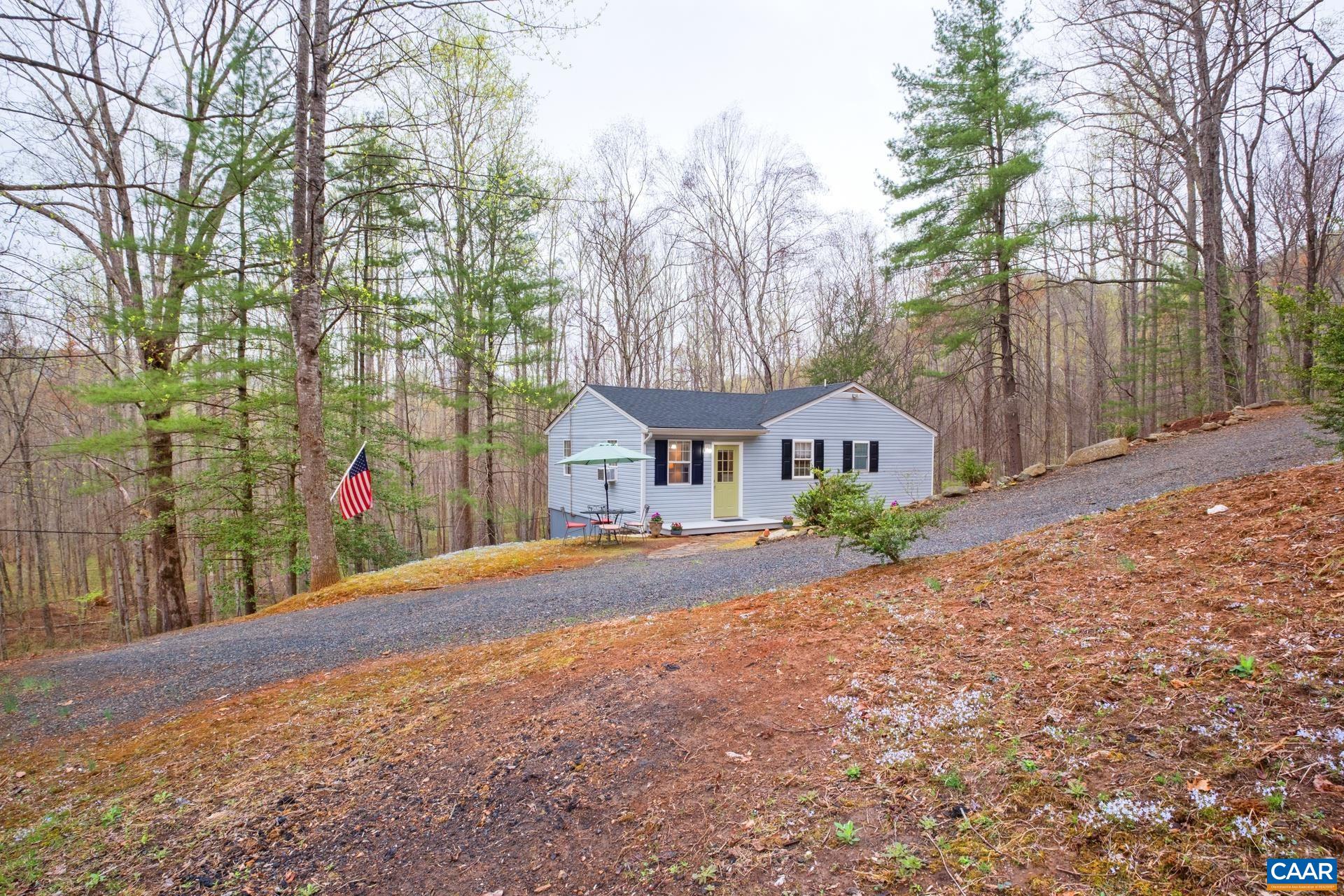 115 Circle Road Stanardsville, VA 22973 - Photo 28 of 28 a front view of a house with a yard and garage