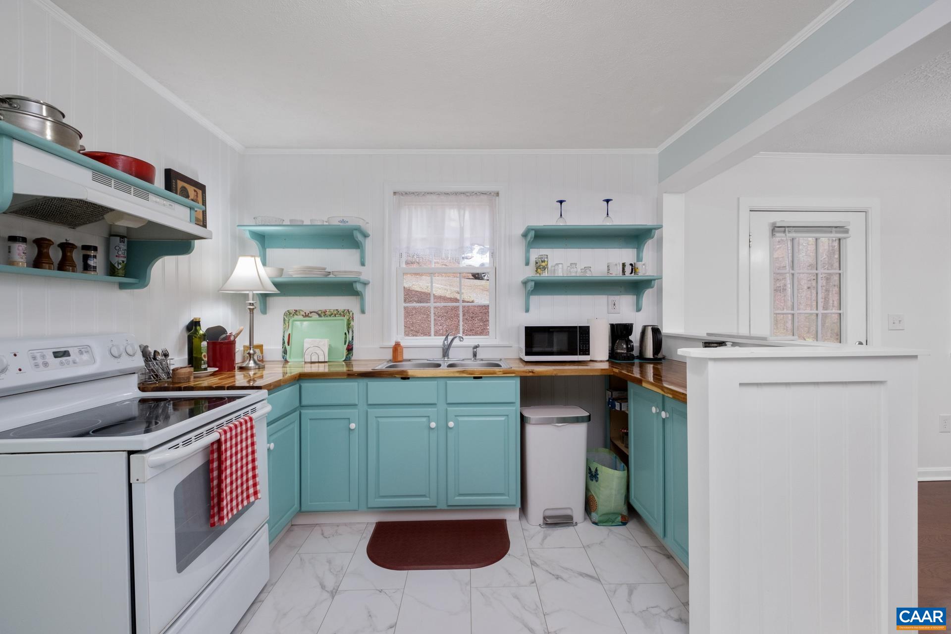 115 Circle Road Stanardsville, VA 22973 - Photo 10 of 28 a kitchen with a sink stove and cabinets