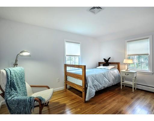 3 Flintlock Circle Hingham, MA 02043 - Photo 16 of 23 a bedroom with a bed and a chair