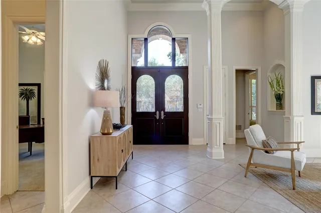 a living room with furniture and a mirror