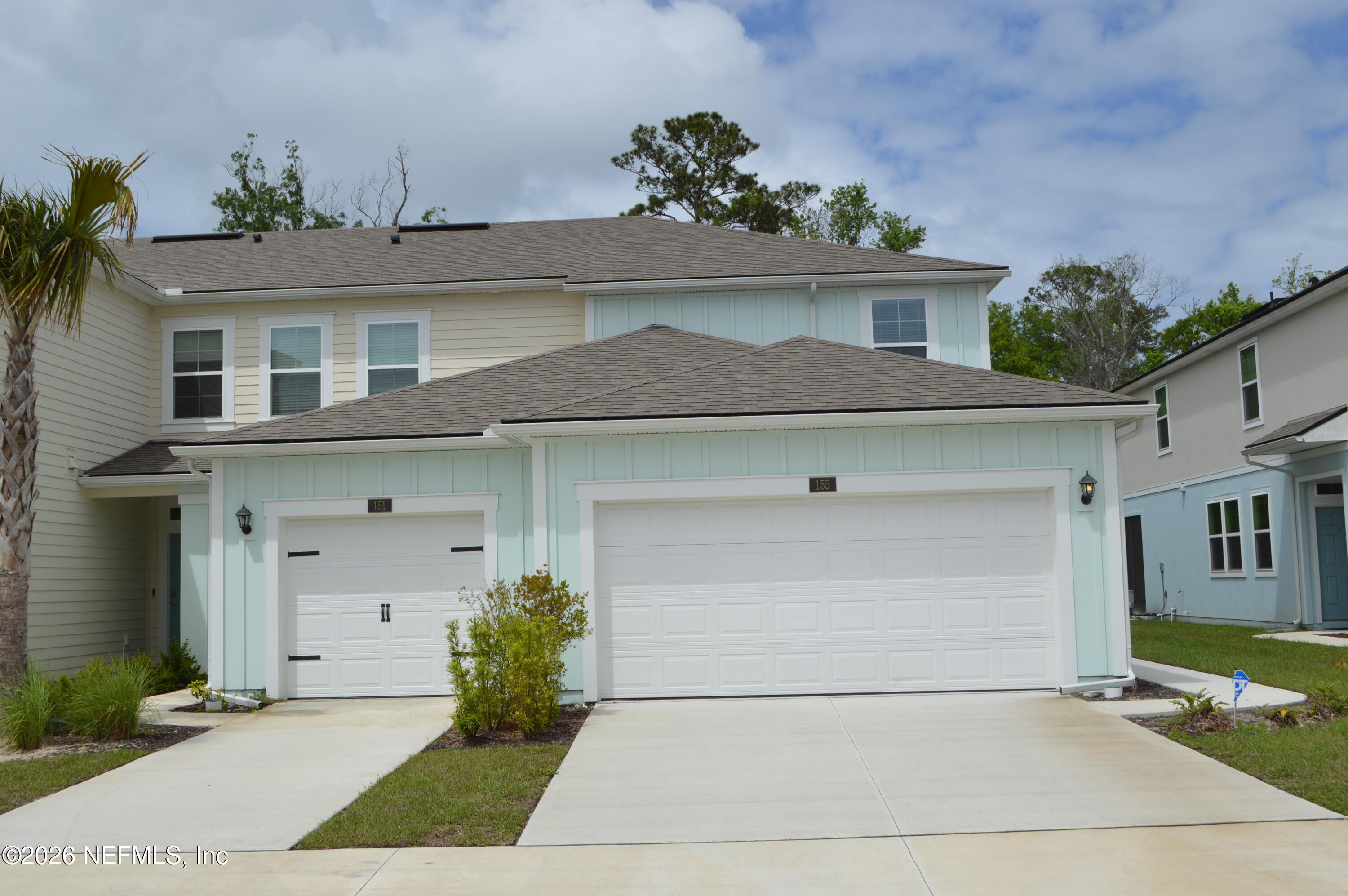 155 Seaport Breeze Road St. Augustine, FL 32095 - Photo 1 of 29 a front view of a house with garage