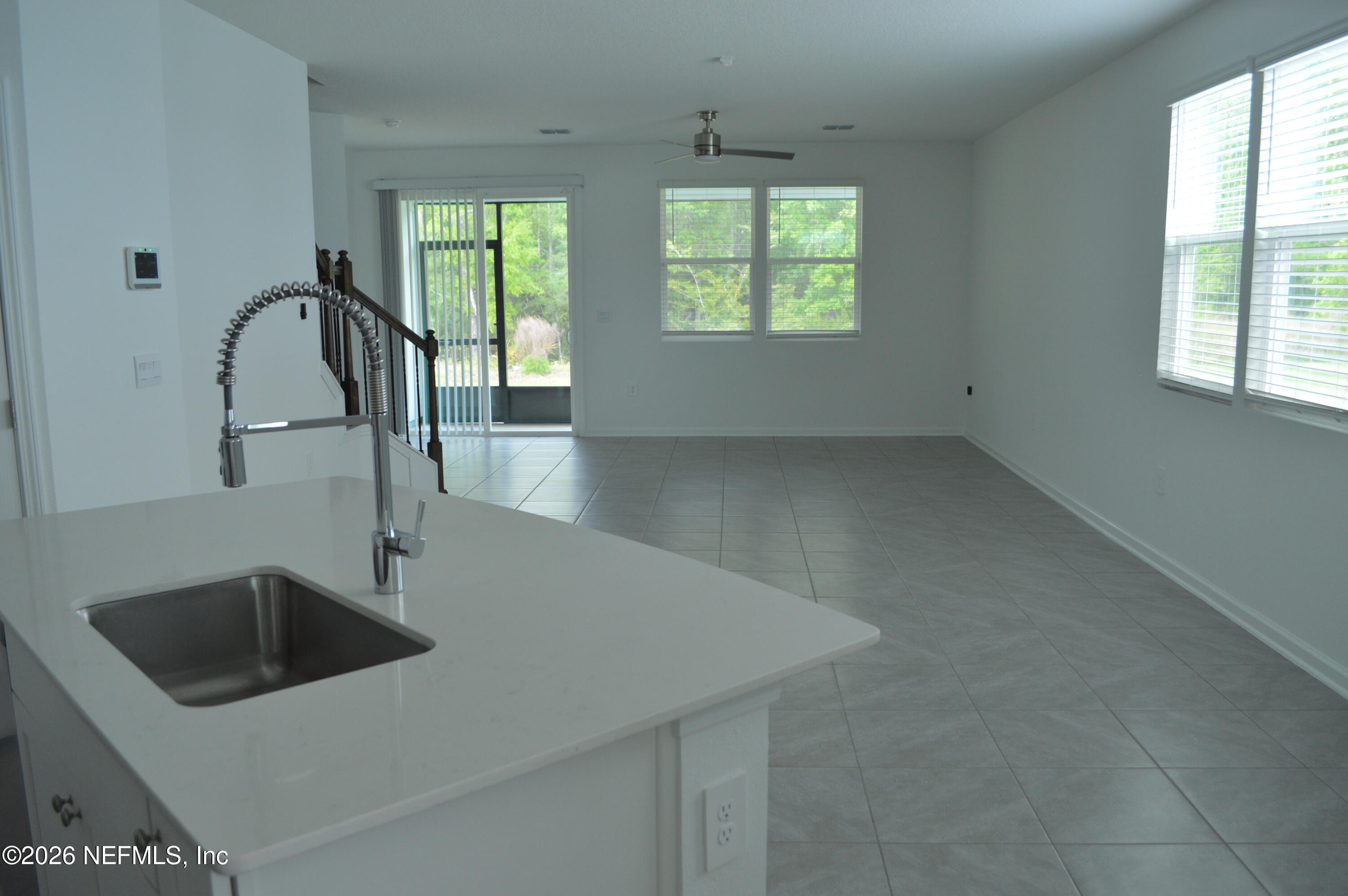 155 Seaport Breeze Road St. Augustine, FL 32095 - Photo 17 of 29 a kitchen with a sink a counter top space and a window