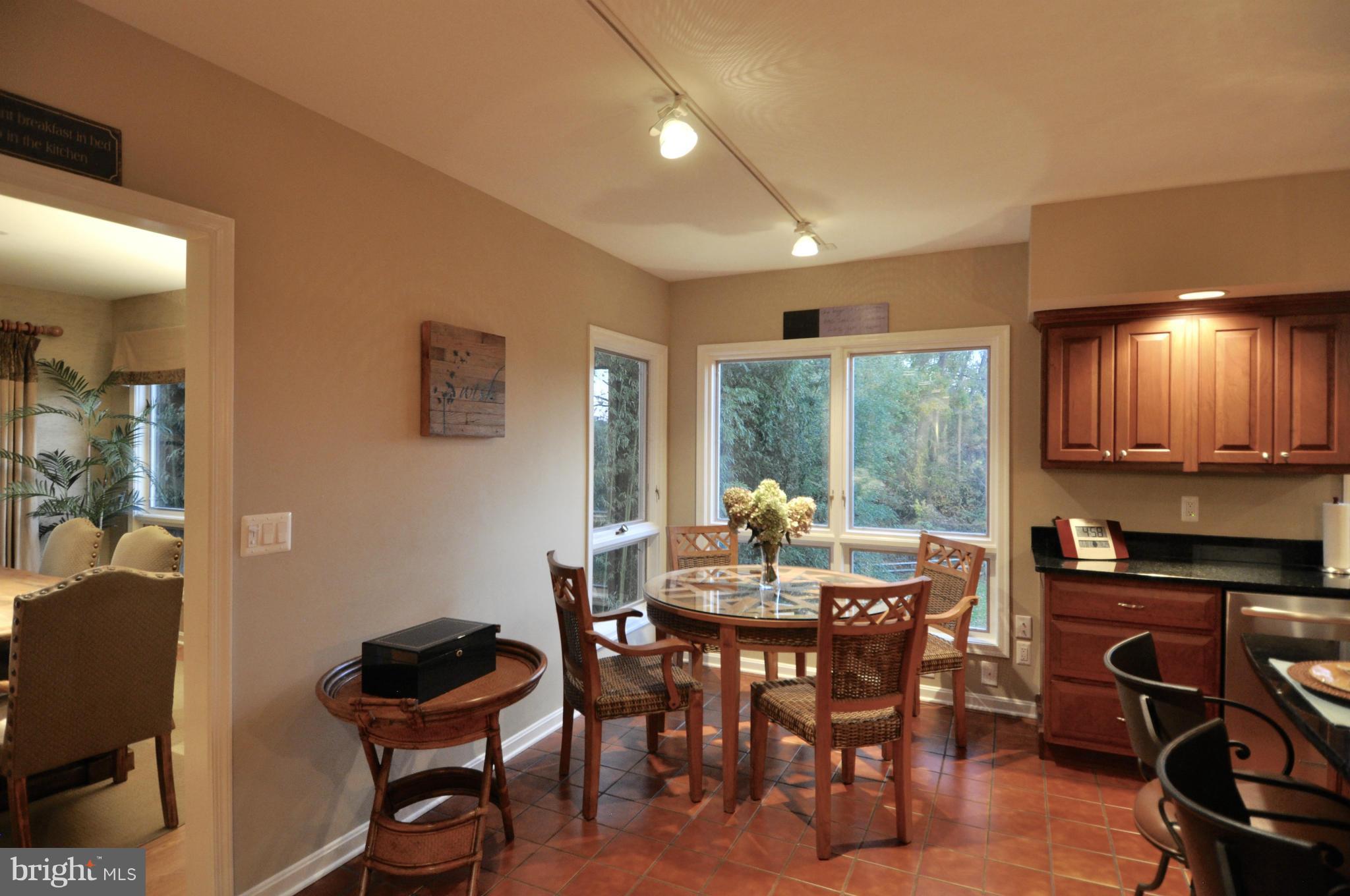 1890 Hidden Point Road Annapolis, MD 21409 - Photo 12 of 30 a view of a dining room with furniture window and outside view