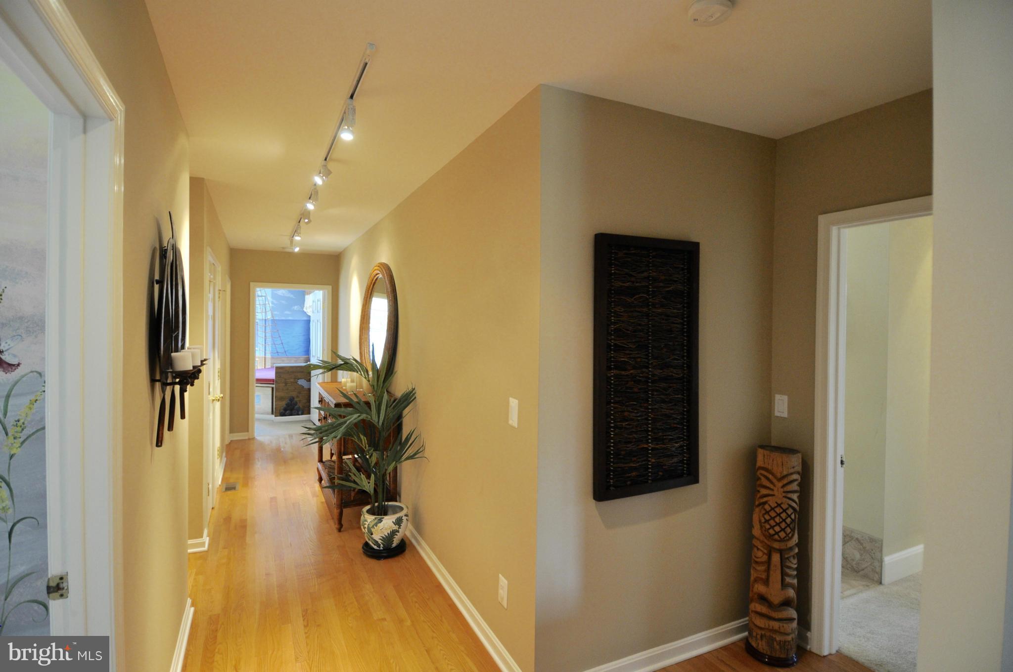 1890 Hidden Point Road Annapolis, MD 21409 - Photo 14 of 30 a view of hallway with wooden floor