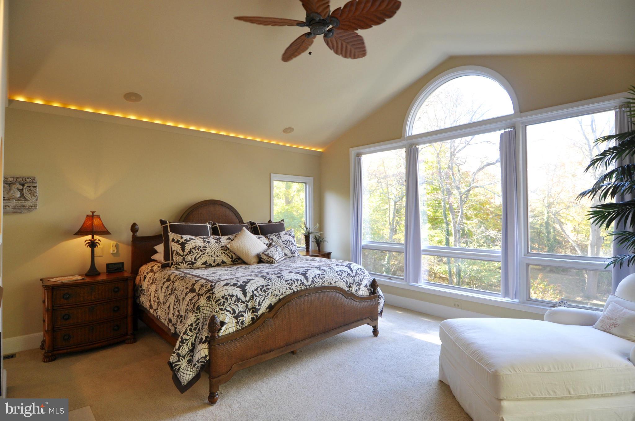 1890 Hidden Point Road Annapolis, MD 21409 - Photo 15 of 30 a bedroom with a bed and a large window