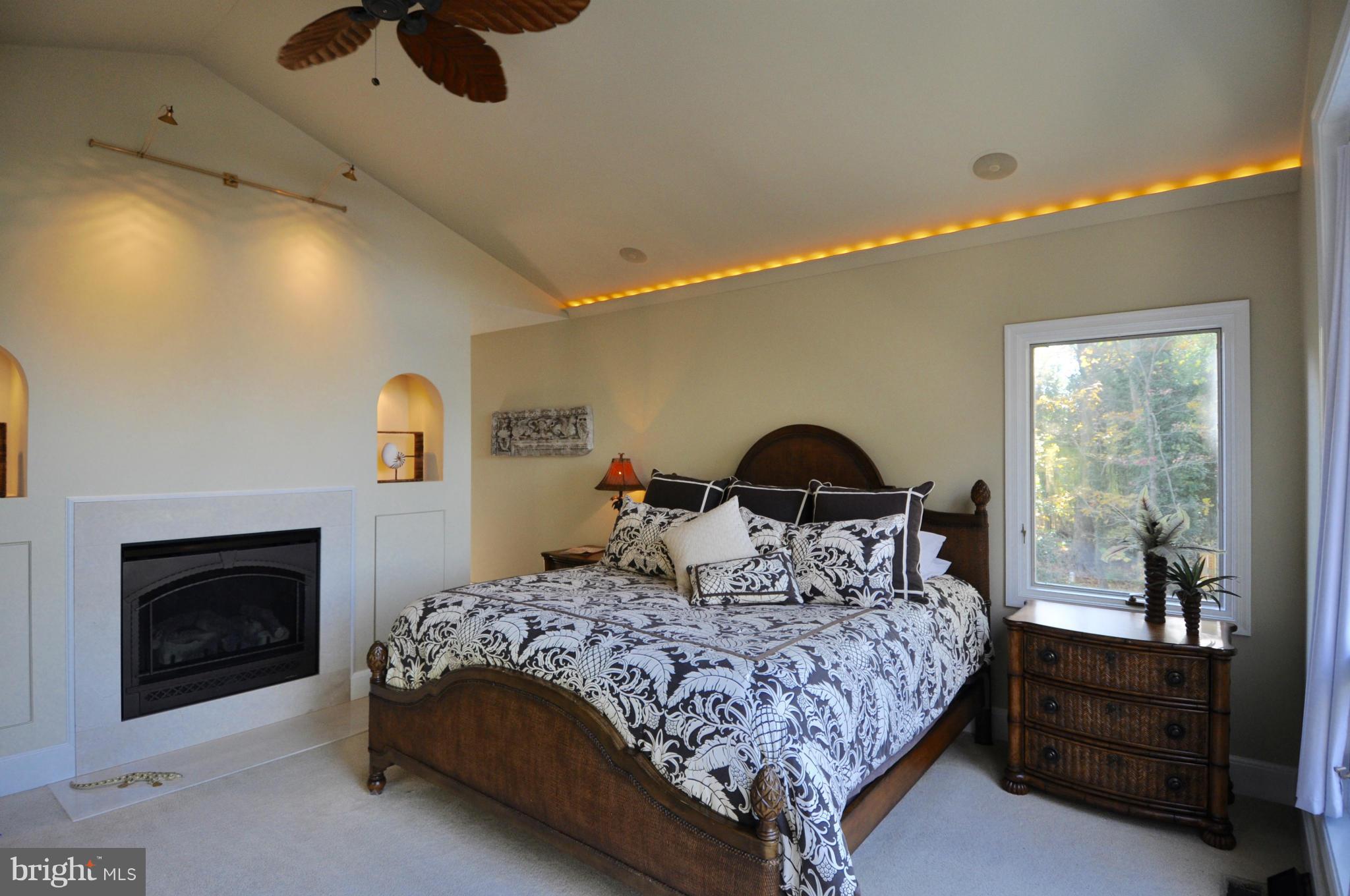 1890 Hidden Point Road Annapolis, MD 21409 - Photo 16 of 30 a bedroom with a large bed and a window