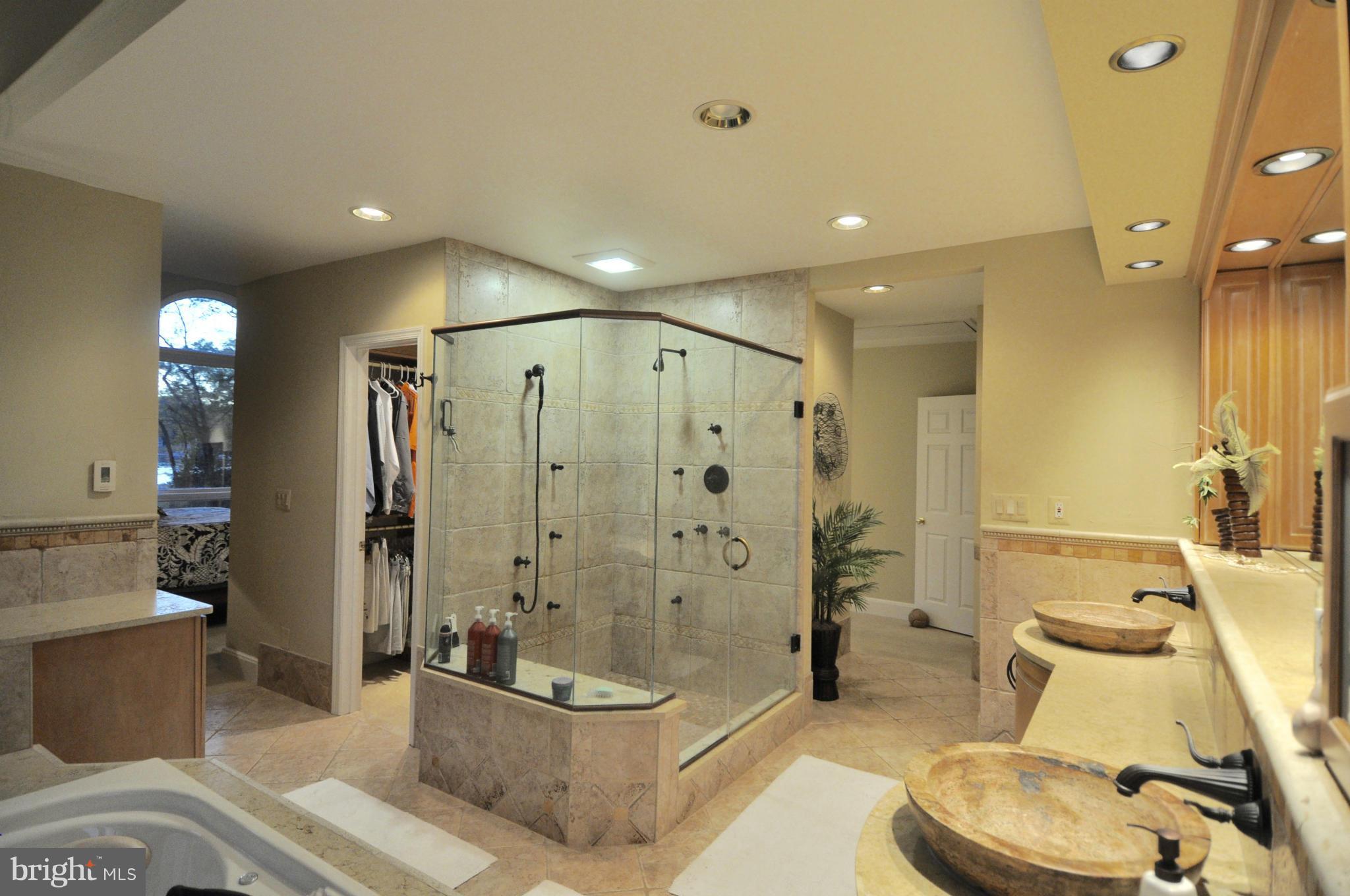 1890 Hidden Point Road Annapolis, MD 21409 - Photo 19 of 30 a bathroom with a sink a toilet and shower