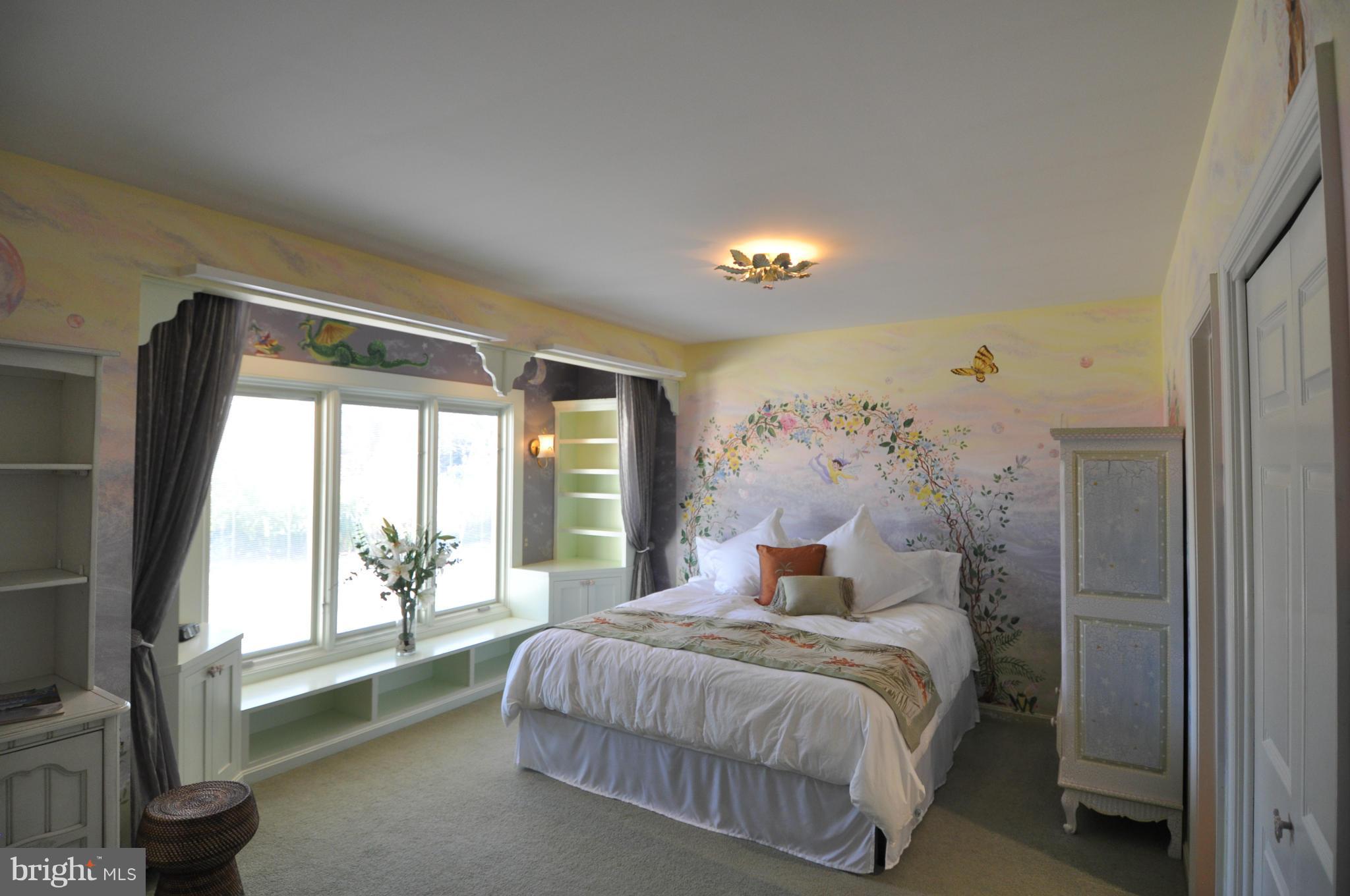 1890 Hidden Point Road Annapolis, MD 21409 - Photo 22 of 30 a spacious bedroom with a large bed and a large window