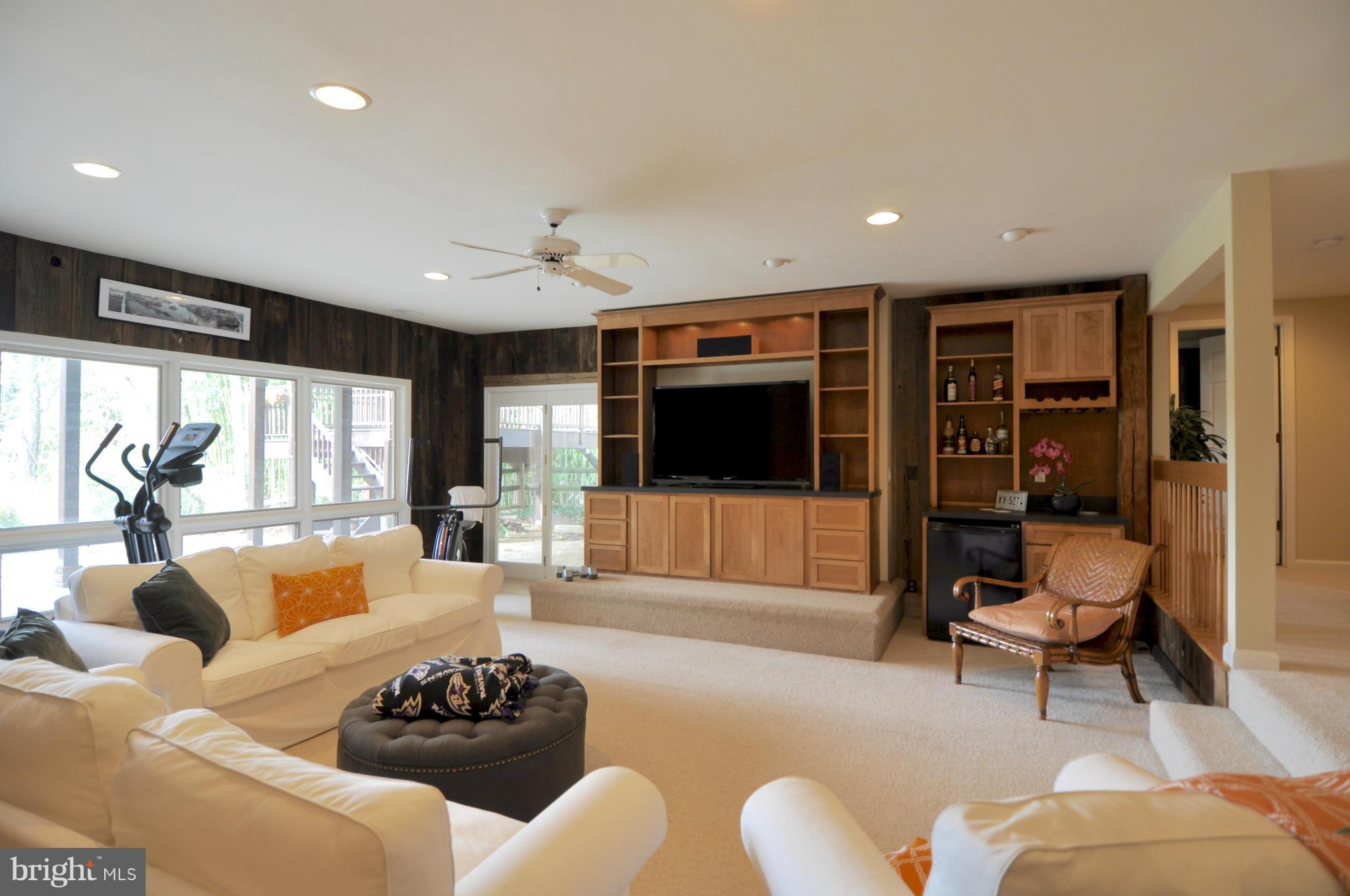 1890 Hidden Point Road Annapolis, MD 21409 - Photo 23 of 30 a living room with furniture window and a flat screen tv