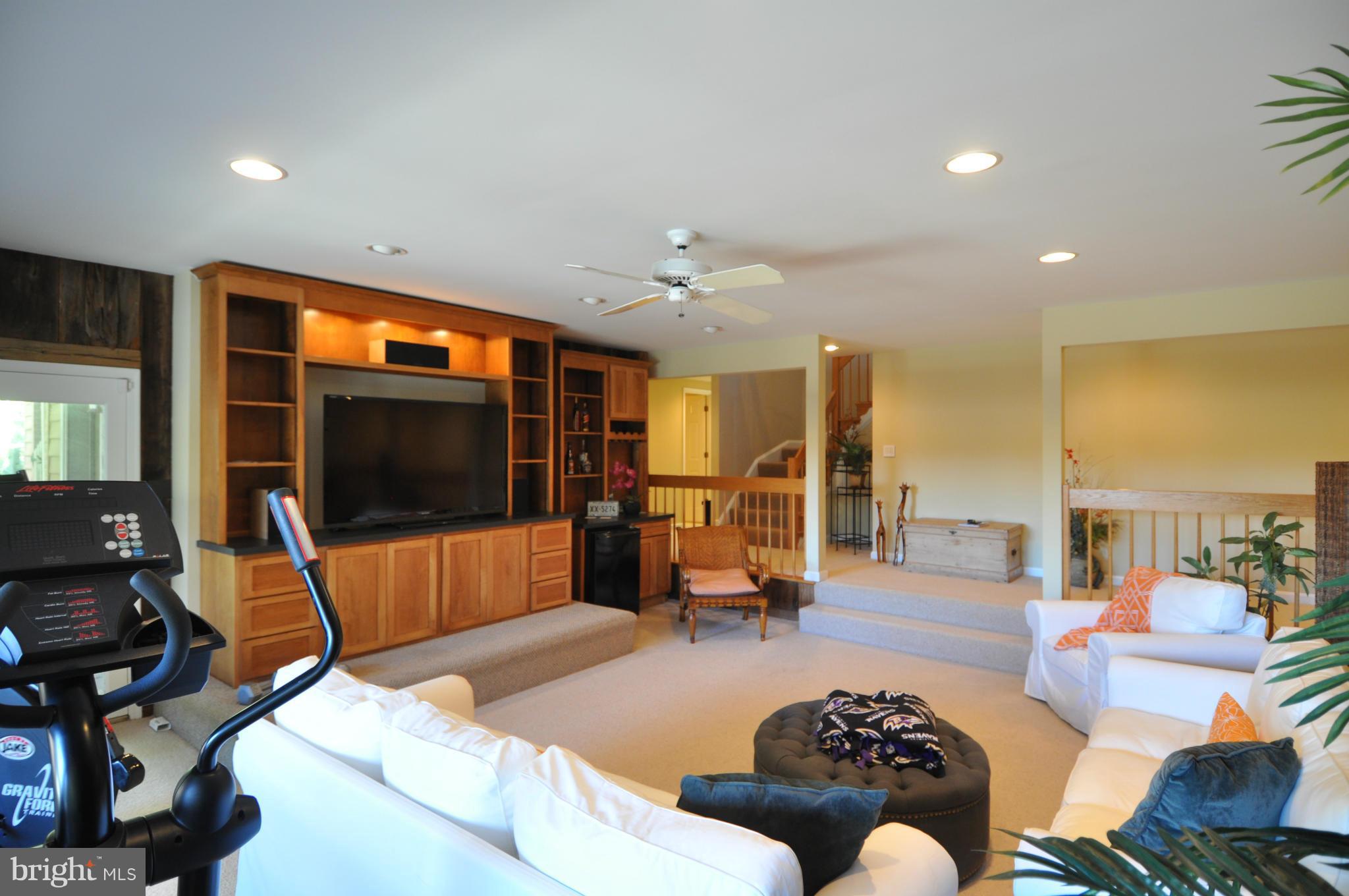 1890 Hidden Point Road Annapolis, MD 21409 - Photo 24 of 30 a living room with furniture and a flat screen tv