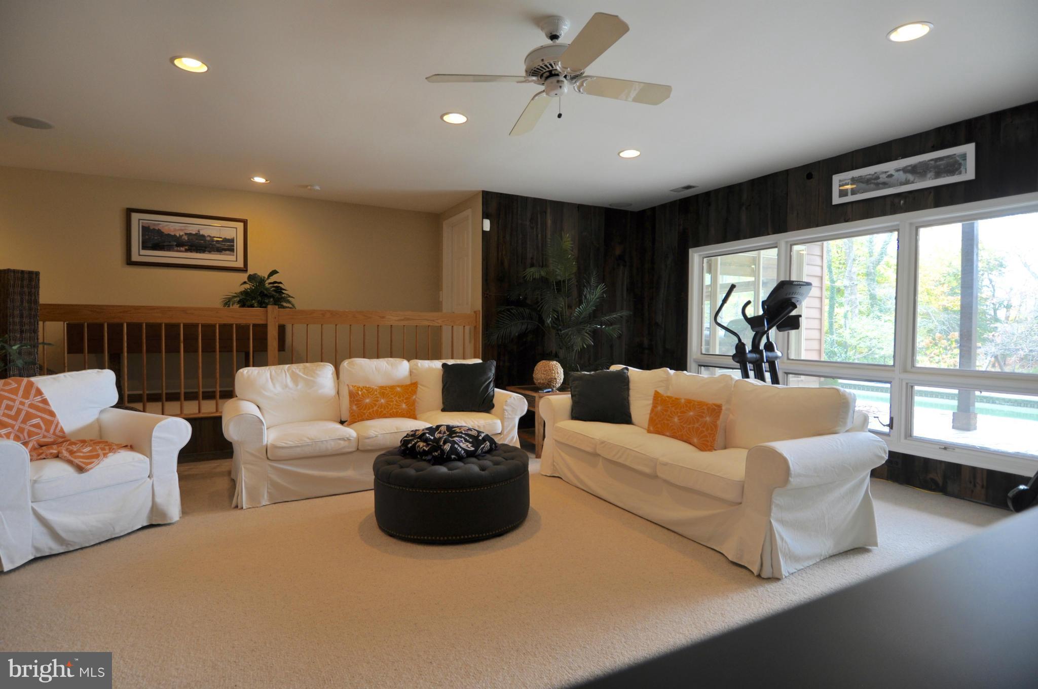 1890 Hidden Point Road Annapolis, MD 21409 - Photo 25 of 30 a living room with furniture and a large window