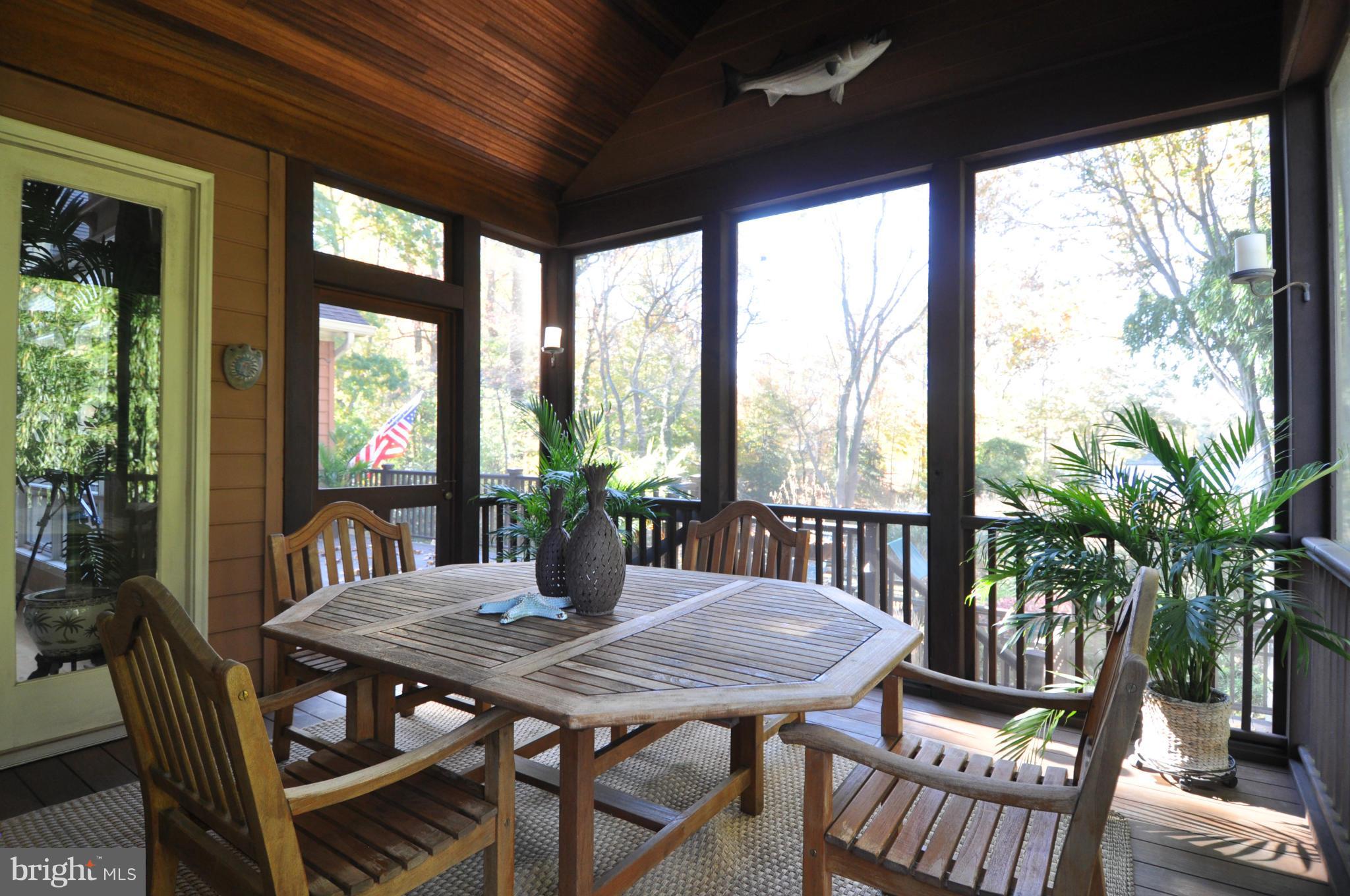 1890 Hidden Point Road Annapolis, MD 21409 - Photo 26 of 30 a view of a dining room with furniture window and wooden floor