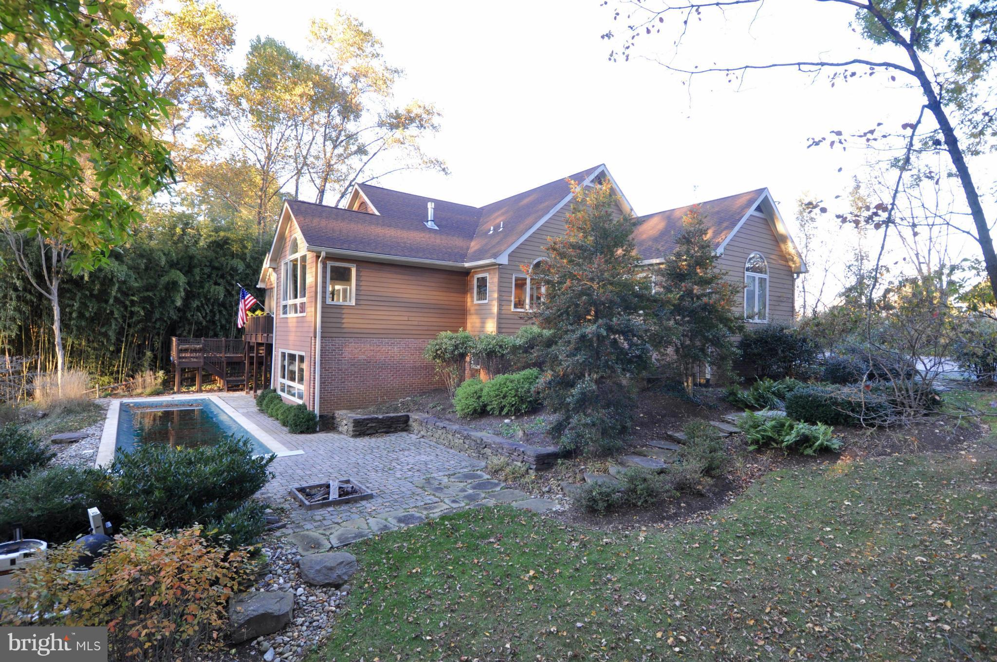 1890 Hidden Point Road Annapolis, MD 21409 - Photo 27 of 30 a view of a house with a yard and plants