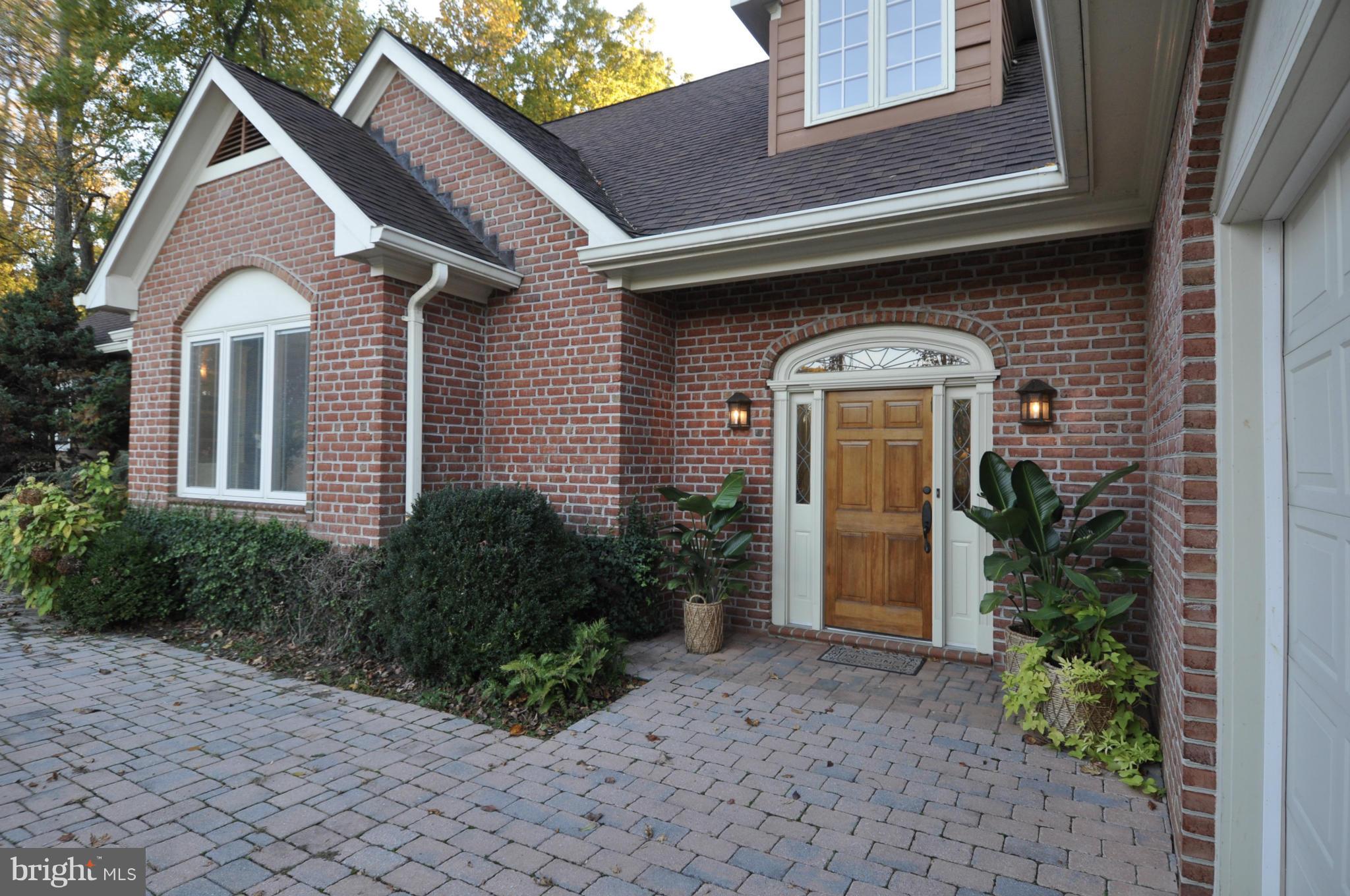 1890 Hidden Point Road Annapolis, MD 21409 - Photo 4 of 30 a front view of a house with garden