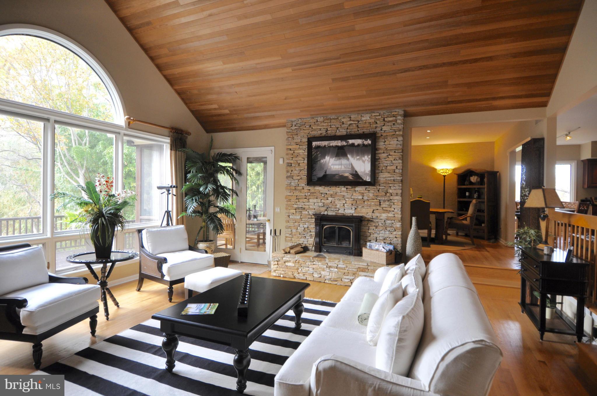 1890 Hidden Point Road Annapolis, MD 21409 - Photo 6 of 30 a living room with furniture fireplace and a large window