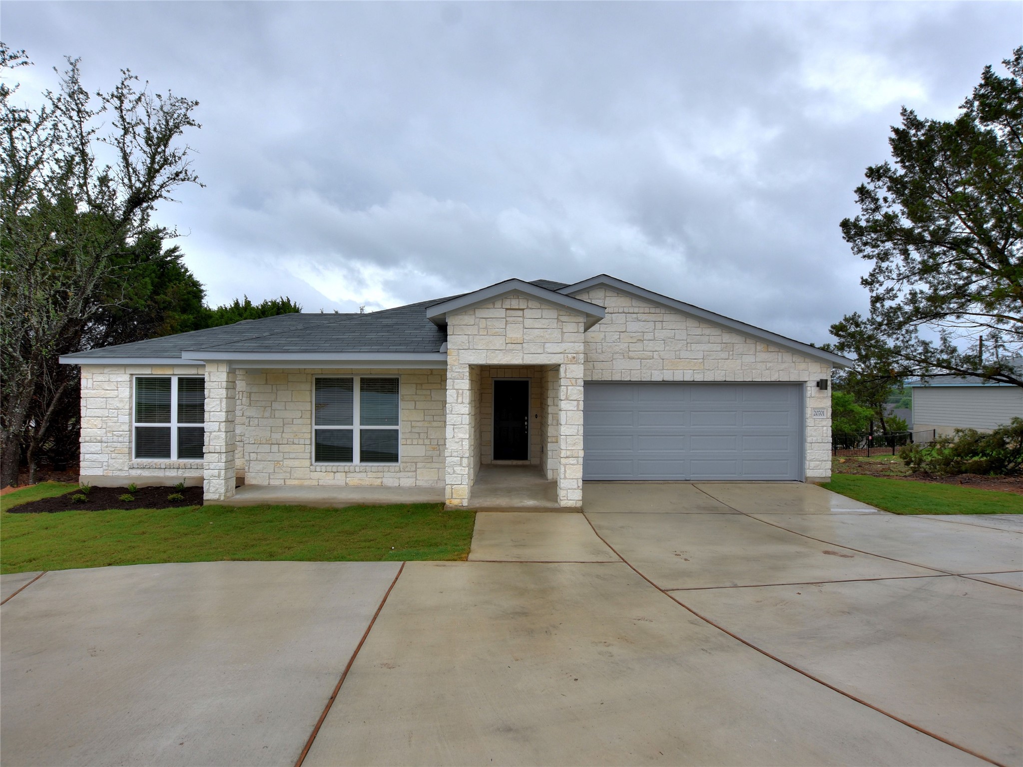 a front view of house with yard and green space