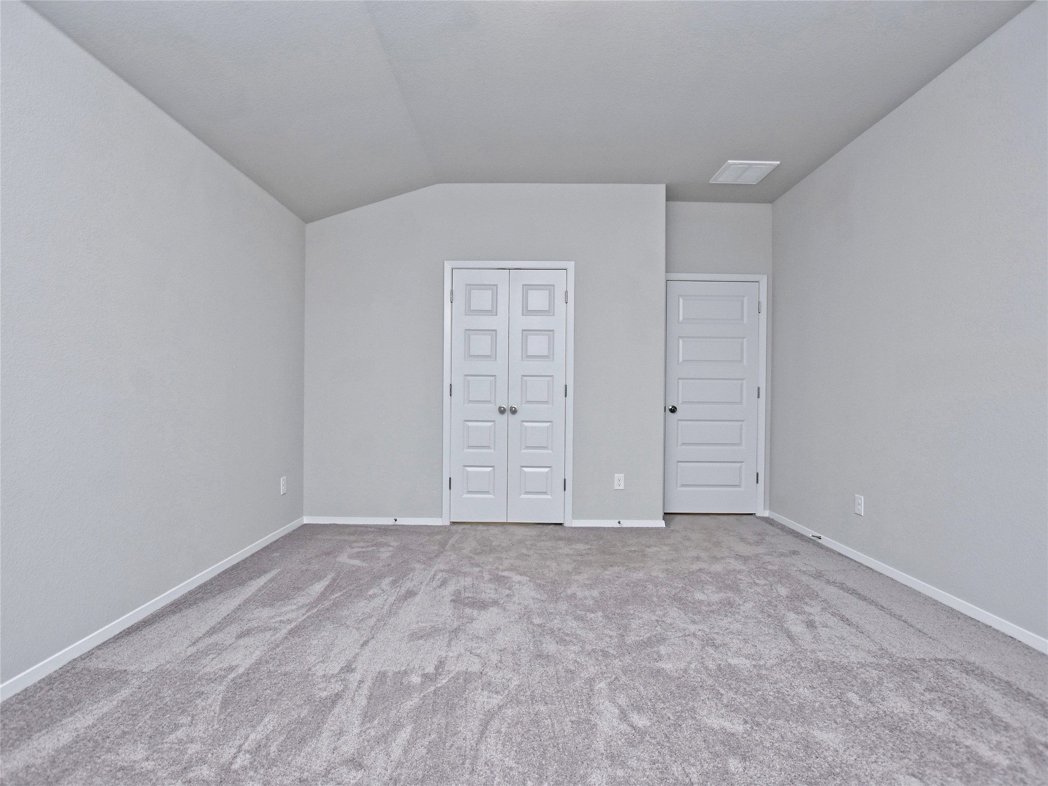 20701 Boggy Ford Road Lago Vista, TX 78645 - Photo 16 of 40 Additional living space with lofted ceiling and carpet