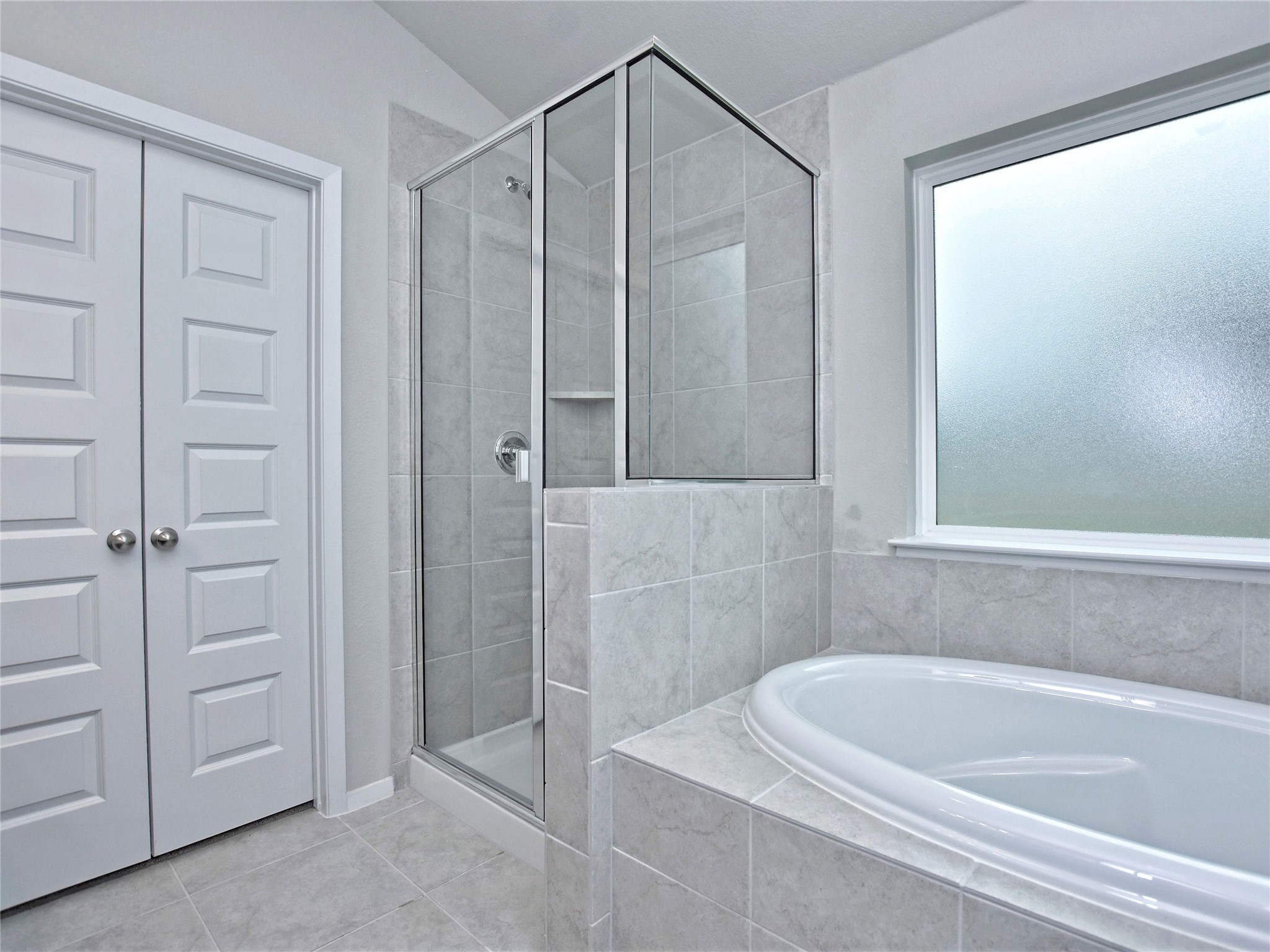20701 Boggy Ford Road Lago Vista, TX 78645 - Photo 19 of 40 Full bath with a shower stall, a bath, and light tile patterned floors