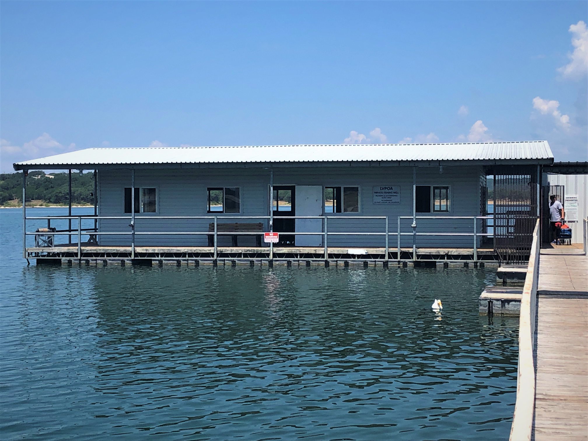 20701 Boggy Ford Road Lago Vista, TX 78645 - Photo 38 of 40 Dock featuring a water view and a porch