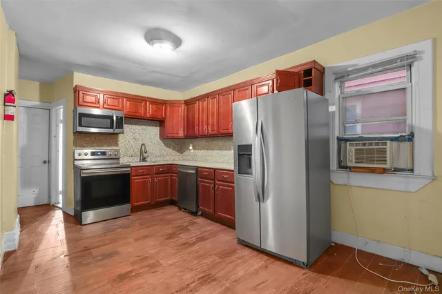 a kitchen that has a sink and a stove