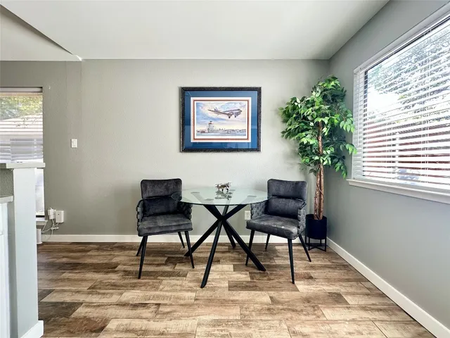 a view of a livingroom with furniture and a window