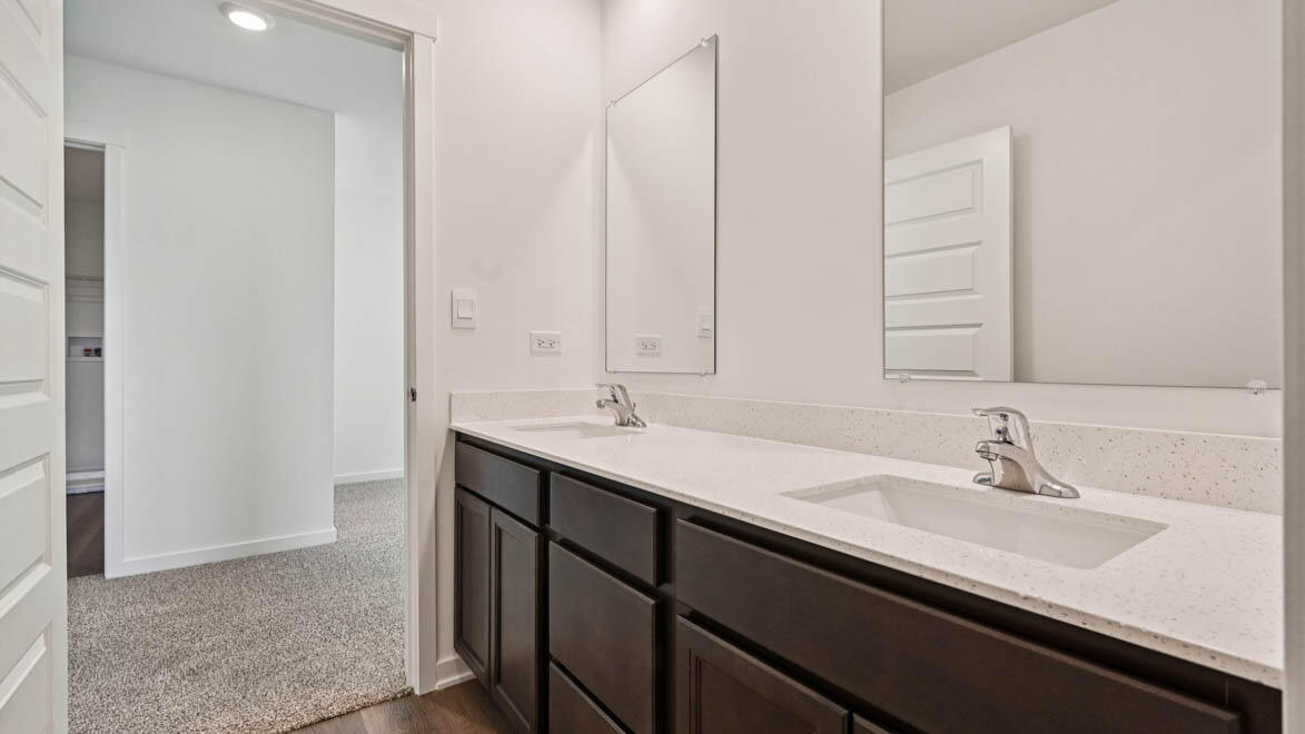 10365 Blaine Street Crown Point, IN 46307 - Photo 24 of 51 a bathroom with a double vanity sink a and mirror
