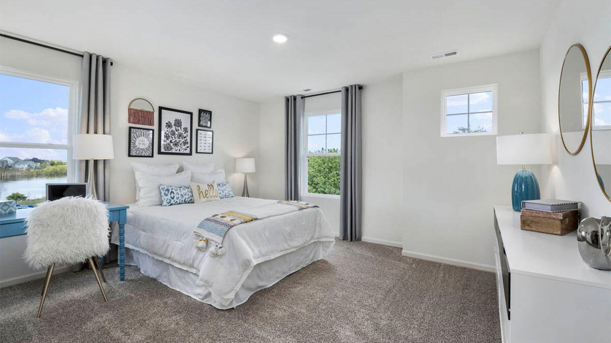 10365 Blaine Street Crown Point, IN 46307 - Photo 46 of 51 a bedroom with a bed and a chair