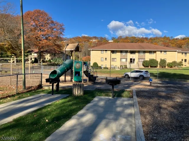 a view of a park with large trees and a big yard