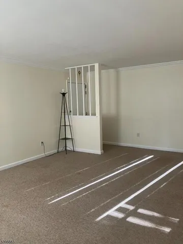 a view of an empty room with windows