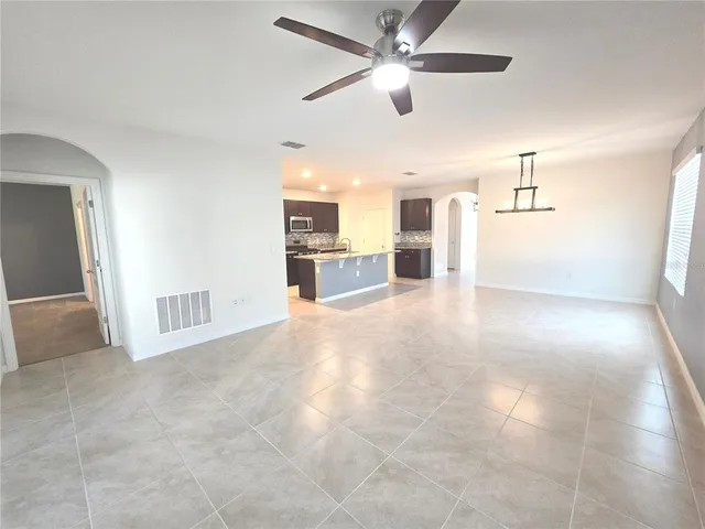 a view of a livingroom with a kitchen