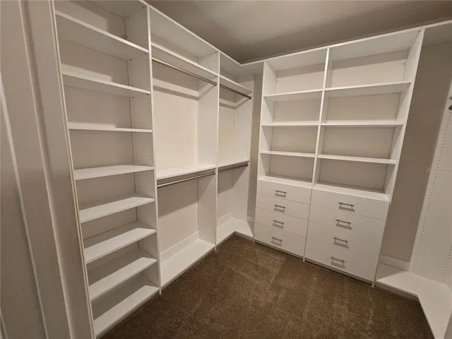 a view of an empty walk in closet