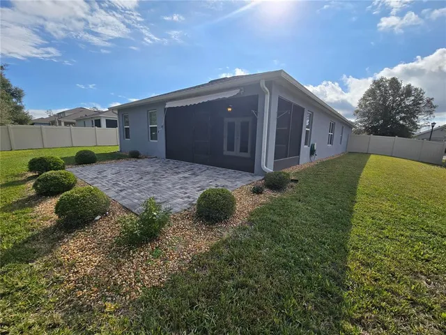 a backyard of a house with lots of green space