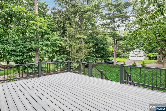 a view of a deck with a yard