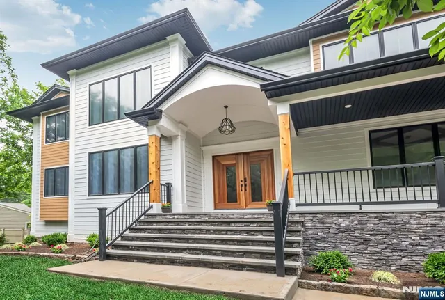 a front view of a house with a porch
